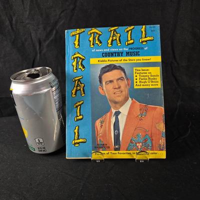 Sale Photo Thumbnail #493: This auction lot is for a 1958 "Trail" Country Music Magazine.  This is a rare copy of a country music-themed magazine. Published in 1958, shows a lot of early music history.  It is in very good condition for it's age.  We've included lots of pictures fro