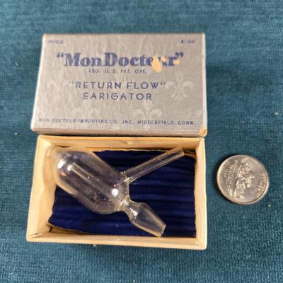 Sale Photo Thumbnail #505: This auction lot is for an Early 20th Century Medical Device - "Mon Docteur". It is an Early 20th Century Medical Device - "Mon Docteur" Return Flow Earigator.  It was made in Middlefield, CT.  The device itself is made of glass and is in it's original bo