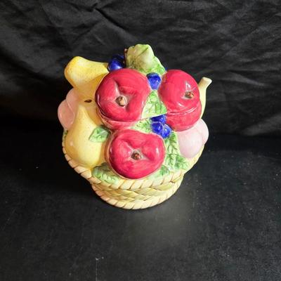 A Fruitful Display - Fruit themed lidded cookie jar - Brass wall plate - Wooden fruit bushel baskets = and a table runner with a fruit...