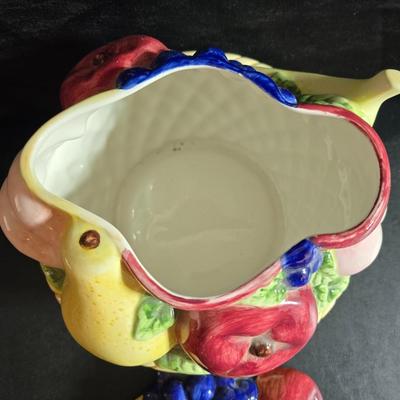 A Fruitful Display - Fruit themed lidded cookie jar - Brass wall plate - Wooden fruit bushel baskets = and a table runner with a fruit...