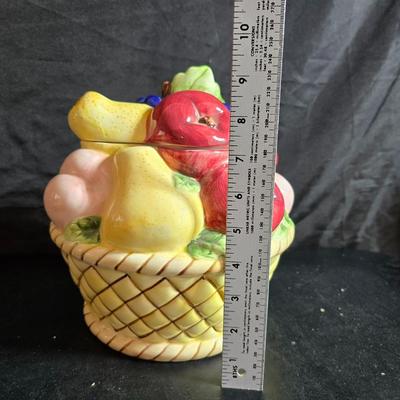 A Fruitful Display - Fruit themed lidded cookie jar - Brass wall plate - Wooden fruit bushel baskets = and a table runner with a fruit...