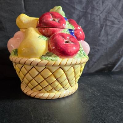 A Fruitful Display - Fruit themed lidded cookie jar - Brass wall plate - Wooden fruit bushel baskets = and a table runner with a fruit...