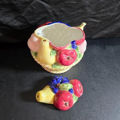 A Fruitful Display - Fruit themed lidded cookie jar - Brass wall plate - Wooden fruit bushel baskets = and a table runner with a fruit...