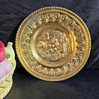 A Fruitful Display - Fruit themed lidded cookie jar - Brass wall plate - Wooden fruit bushel baskets = and a table runner with a fruit...