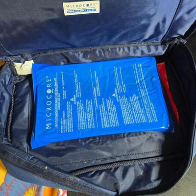 Two 9" x 13" glass Cake pans with Pyrex Portables insulated casserole carrier travel bags a tablecloth and a new flip flop...