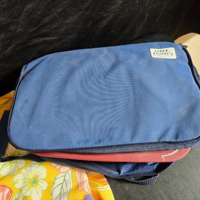 Two 9" x 13" glass Cake pans with Pyrex Portables insulated casserole carrier travel bags a tablecloth and a new flip flop...