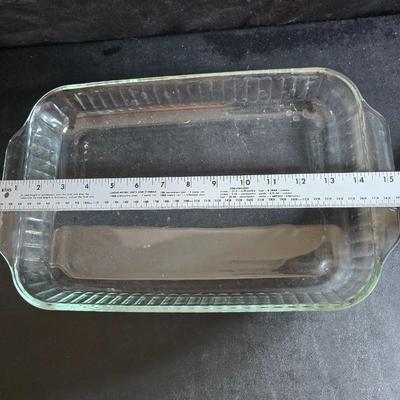 Two 9" x 13" glass Cake pans with Pyrex Portables insulated casserole carrier travel bags a tablecloth and a new flip flop...