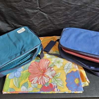 Two 9" x 13" glass Cake pans with Pyrex Portables insulated casserole carrier travel bags a tablecloth and a new flip flop...