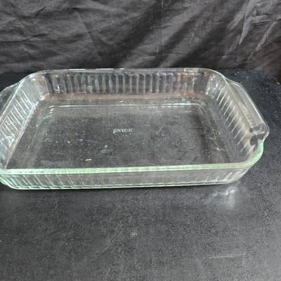 Two 9" x 13" glass Cake pans with Pyrex Portables insulated casserole carrier travel bags a tablecloth and a new flip flop...