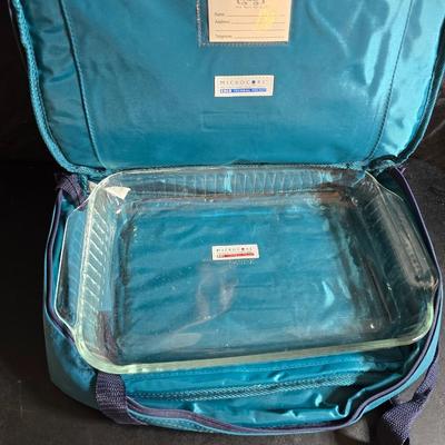 Two 9" x 13" glass Cake pans with Pyrex Portables insulated casserole carrier travel bags a tablecloth and a new flip flop...