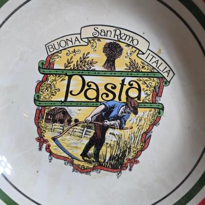 Two large serving bowls a glass cake pan, strainer and 5 square glass containers with cork stoppers