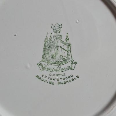 Two large serving bowls a glass cake pan, strainer and 5 square glass containers with cork stoppers