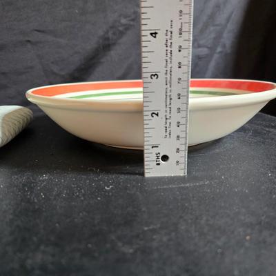 Two large serving bowls a glass cake pan, strainer and 5 square glass containers with cork stoppers