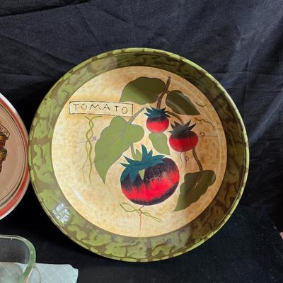 Two large serving bowls a glass cake pan, strainer and 5 square glass containers with cork stoppers