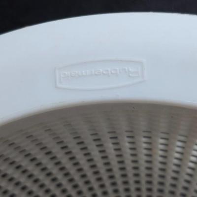 Two large serving bowls a glass cake pan, strainer and 5 square glass containers with cork stoppers