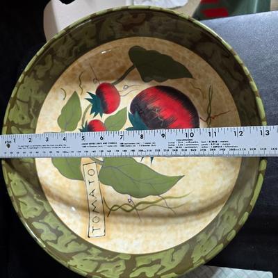 Two large serving bowls a glass cake pan, strainer and 5 square glass containers with cork stoppers