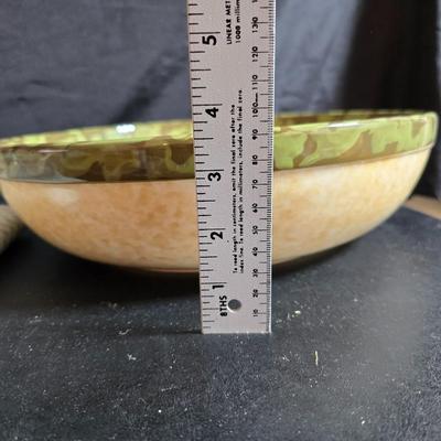 Two large serving bowls a glass cake pan, strainer and 5 square glass containers with cork stoppers