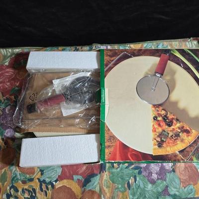Brand new Hometrends Pizza stone with New 12" Beachwood chip n dip wither ceramic bowl and a tablecloth