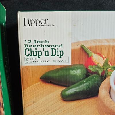 Brand new Hometrends Pizza stone with New 12" Beachwood chip n dip wither ceramic bowl and a tablecloth