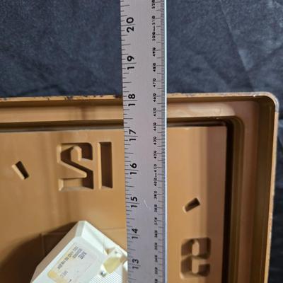 Working 1970s Coca-Cola wall clock with a faux wood grain plastic frame and a commemorative Coca-Cola bottle from the 1984 Summer...