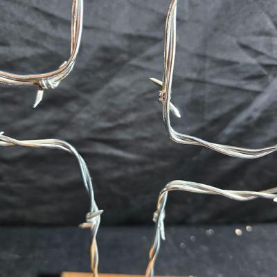 Western themed barbed wire cactus with barbed wire boot and star and a Wilton Armetale pewter cowboy boot pitcher.