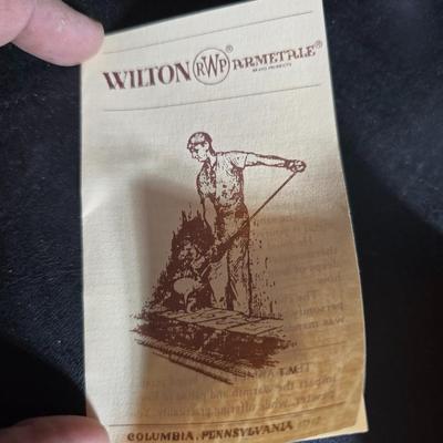 Western themed barbed wire cactus with barbed wire boot and star and a Wilton Armetale pewter cowboy boot pitcher.