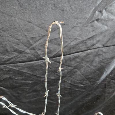 Western themed barbed wire cactus with barbed wire boot and star and a Wilton Armetale pewter cowboy boot pitcher.