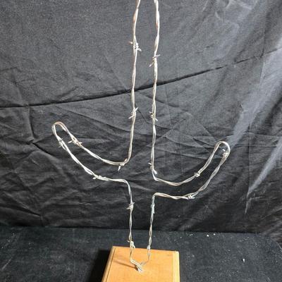 Western themed barbed wire cactus with barbed wire boot and star and a Wilton Armetale pewter cowboy boot pitcher.