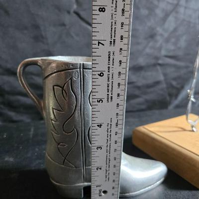 Western themed barbed wire cactus with barbed wire boot and star and a Wilton Armetale pewter cowboy boot pitcher.