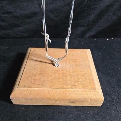 Western themed barbed wire cactus with barbed wire boot and star and a Wilton Armetale pewter cowboy boot pitcher.