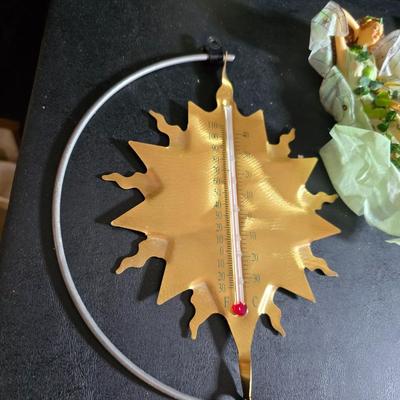 Two metal floral wall buckets with a Fairy, a suncatcher and a thermometer