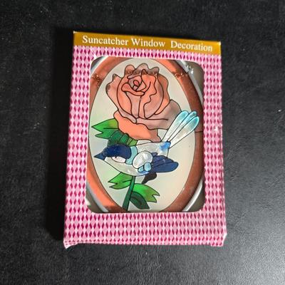 Two metal floral wall buckets with a Fairy, a suncatcher and a thermometer