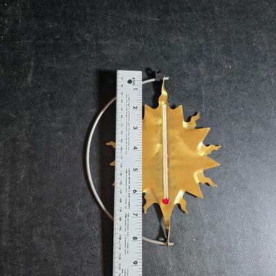 Two metal floral wall buckets with a Fairy, a suncatcher and a thermometer