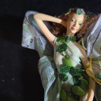 Two metal floral wall buckets with a Fairy, a suncatcher and a thermometer