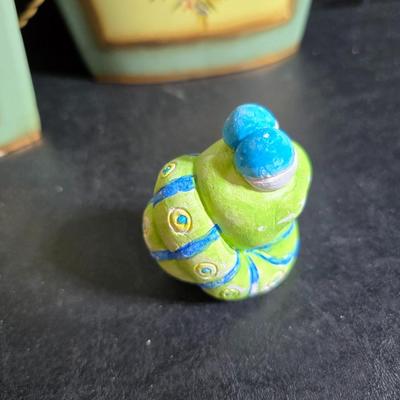 Two matching floral wall buckets, Butterflies, Sun dial clock, a small ceramic garden worm, and a decorative wall hanging