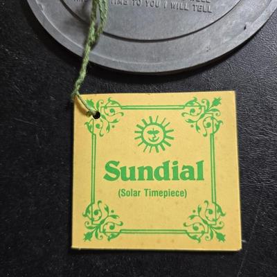 Two matching floral wall buckets, Butterflies, Sun dial clock, a small ceramic garden worm, and a decorative wall hanging