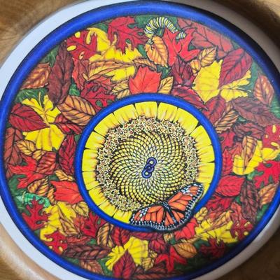 Two matching floral wall buckets, Butterflies, Sun dial clock, a small ceramic garden worm, and a decorative wall hanging