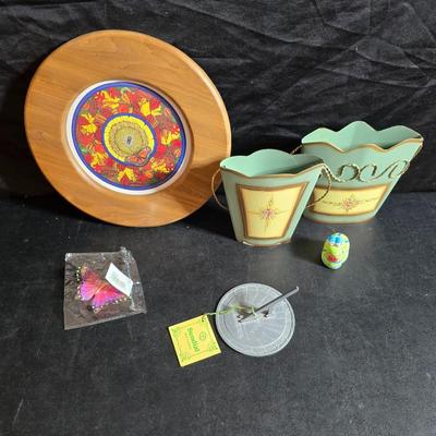 Two matching floral wall buckets, Butterflies, Sun dial clock, a small ceramic garden worm, and a decorative wall hanging