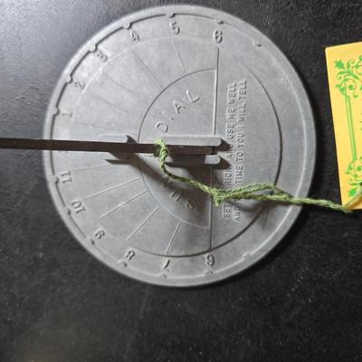 Two matching floral wall buckets, Butterflies, Sun dial clock, a small ceramic garden worm, and a decorative wall hanging