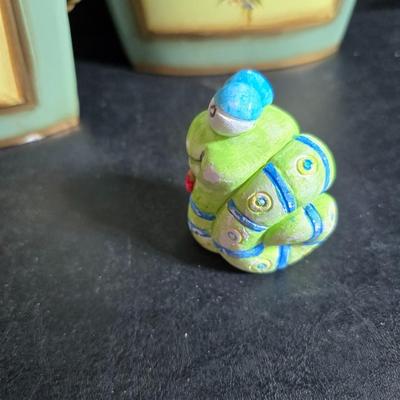 Two matching floral wall buckets, Butterflies, Sun dial clock, a small ceramic garden worm, and a decorative wall hanging