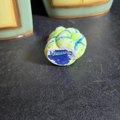 Two matching floral wall buckets, Butterflies, Sun dial clock, a small ceramic garden worm, and a decorative wall hanging