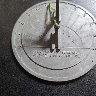 Two matching floral wall buckets, Butterflies, Sun dial clock, a small ceramic garden worm, and a decorative wall hanging