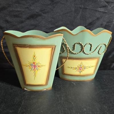 Two matching floral wall buckets, Butterflies, Sun dial clock, a small ceramic garden worm, and a decorative wall hanging