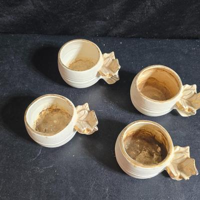 Antique cast metal gold guild clock face frame with Saja China dish - four small, vintage ceramic cups with leaf like handles and a small...