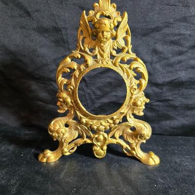 Antique cast metal gold guild clock face frame with Saja China dish - four small, vintage ceramic cups with leaf like handles and a small...