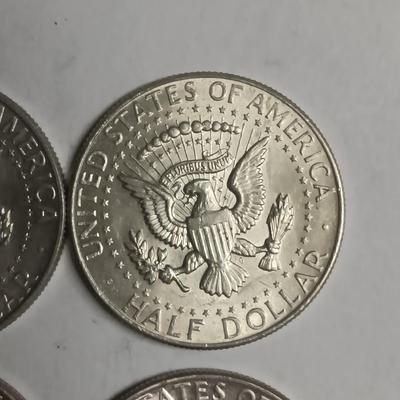 FOUR 1964 KENNEDY SILVER HALF DOLLARS