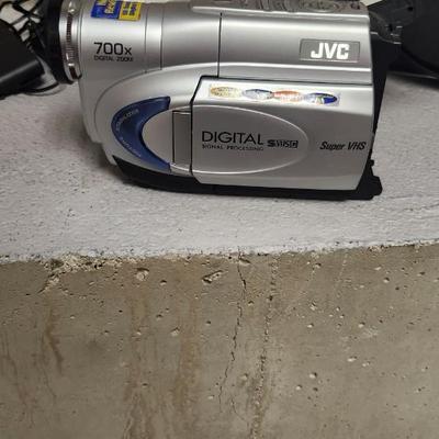 Sale Photo Thumbnail #687: JVC Super VHS video camera with a couple tapes, a converter, battery, charger cord and case. Fits large flat rate box