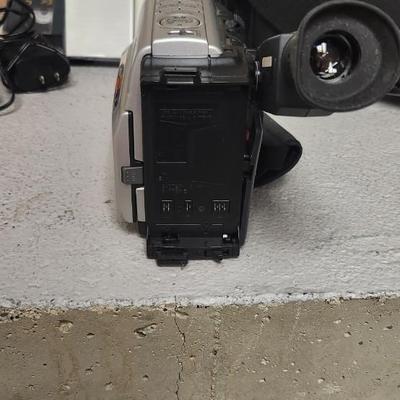 Sale Photo Thumbnail #688: JVC Super VHS video camera with a couple tapes, a converter, battery, charger cord and case. Fits large flat rate box