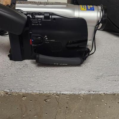 Sale Photo Thumbnail #689: JVC Super VHS video camera with a couple tapes, a converter, battery, charger cord and case. Fits large flat rate box
