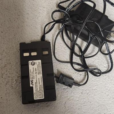 Sale Photo Thumbnail #695: JVC Super VHS video camera with a couple tapes, a converter, battery, charger cord and case. Fits large flat rate box